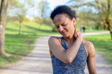 neck pain in female in park